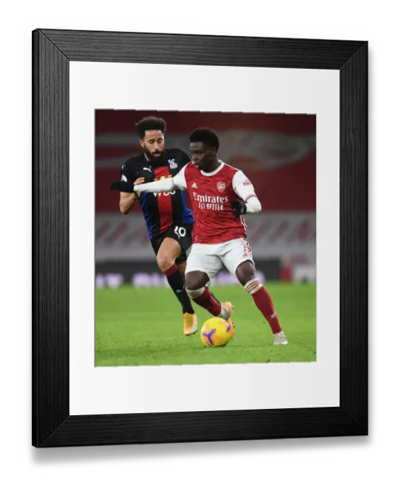 Framed Print : Arsenal's Bukayo Saka in Action: Premier League Showdown at Empty Emirates Against Crystal Palace, 2021 Framed Print : Arsenal's Bukayo Saka in Action: Premier League Showdown at Empty Emirates Against Crystal Palace, 2021