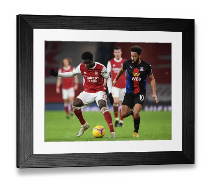 Framed Print : Arsenal's Bukayo Saka in Action: Premier League Clash Against Crystal Palace at Empty Emirates Stadium (2020-21) Framed Print : Arsenal's Bukayo Saka in Action: Premier League Clash Against Crystal Palace at Empty Emirates Stadium (2020-21)