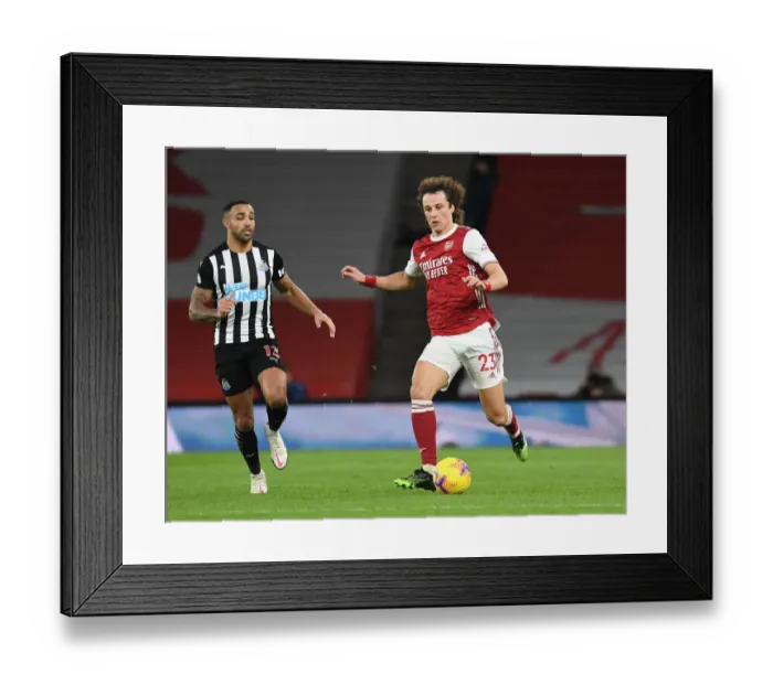 Framed Print : Arsenal's David Luiz Outmaneuvers Newcastle's Callum Wilson in Empty Emirates Stadium