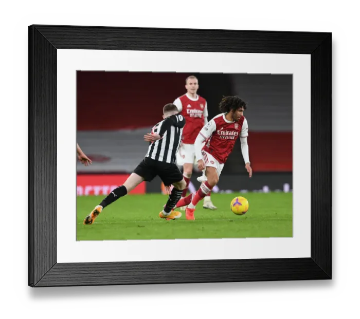 Framed Print : Arsenal vs Newcastle United: A Battle at Emirates Stadium Amidst Pandemic Restrictions Framed Print : Arsenal vs Newcastle United: A Battle at Emirates Stadium Amidst Pandemic Restrictions
