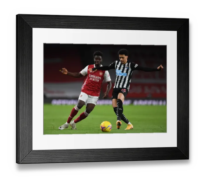Framed Print : Arsenal vs Newcastle United: Bukayo Saka Fouled in Empty Emirates Stadium, Premier League Clash (January 18, 2021)