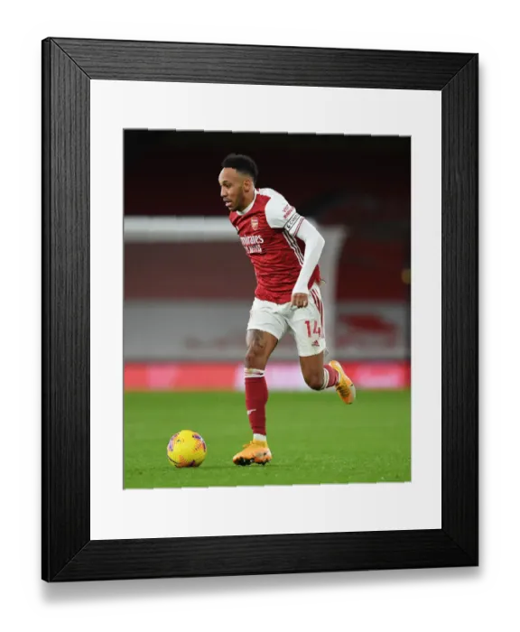 Framed Print : Arsenal's Aubameyang Shines in Empty Emirates Against Newcastle (2020-21) Framed Print : Arsenal's Aubameyang Shines in Empty Emirates Against Newcastle (2020-21)
