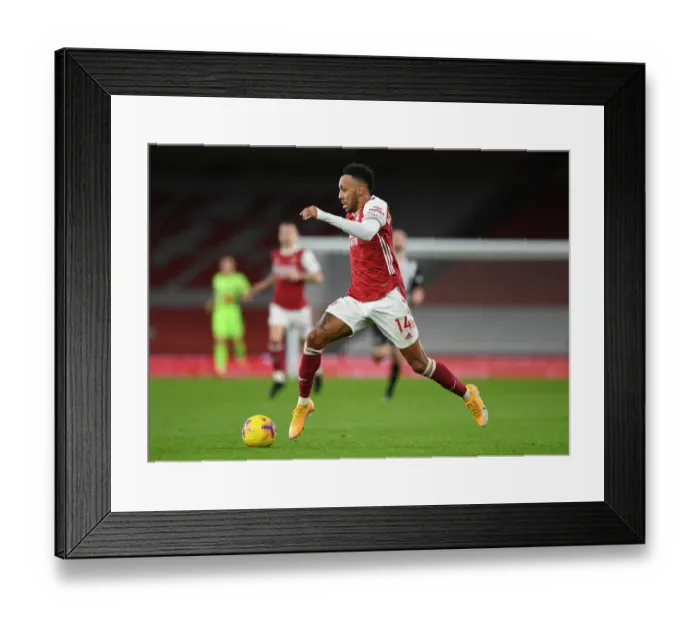Framed Print : Arsenal's Aubameyang Shines Alone: A Lone Star Performance at Empty Emirates Against Newcastle (2020-21)