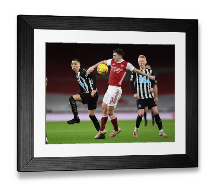 Framed Print : Arsenal vs Newcastle United: Tierney Faces Almiron in Empty Emirates Stadium, Premier League Clash (January 18, 2021)