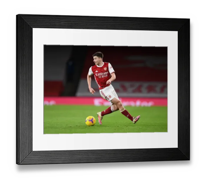 Framed Print : Arsenal's Kieran Tierney in Action: A Battle at Empty Emirates Against Newcastle United (2020-21)
