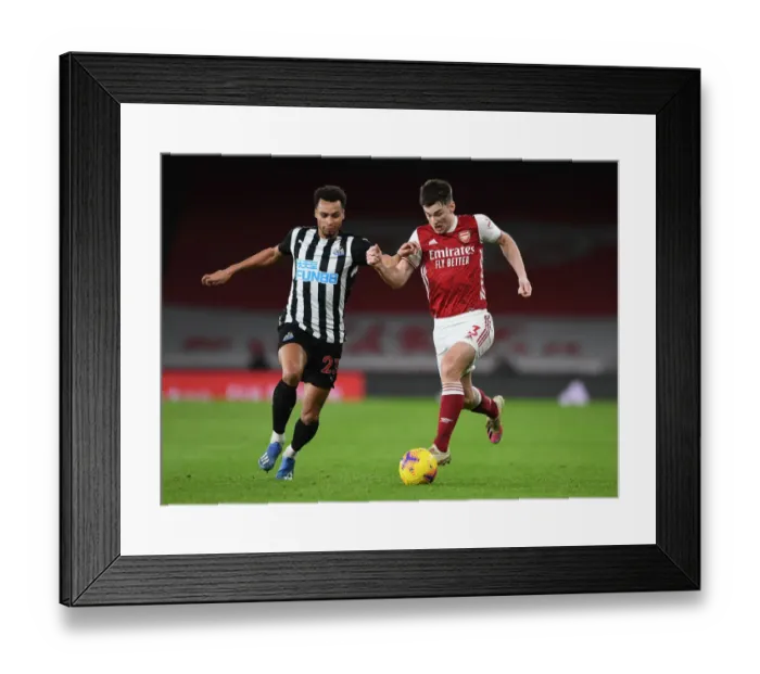 Framed Print : Arsenal vs Newcastle United: Tierney Takes on Murphy in Empty Emirates Stadium