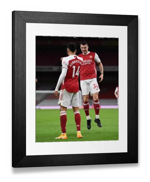 Framed Print : Arsenal's Xhaka and Aubameyang Celebrate First Goal in Empty Emirates Stadium Against Newcastle United (2021) Framed Print : Arsenal's Xhaka and Aubameyang Celebrate First Goal in Empty Emirates Stadium Against Newcastle United (2021)