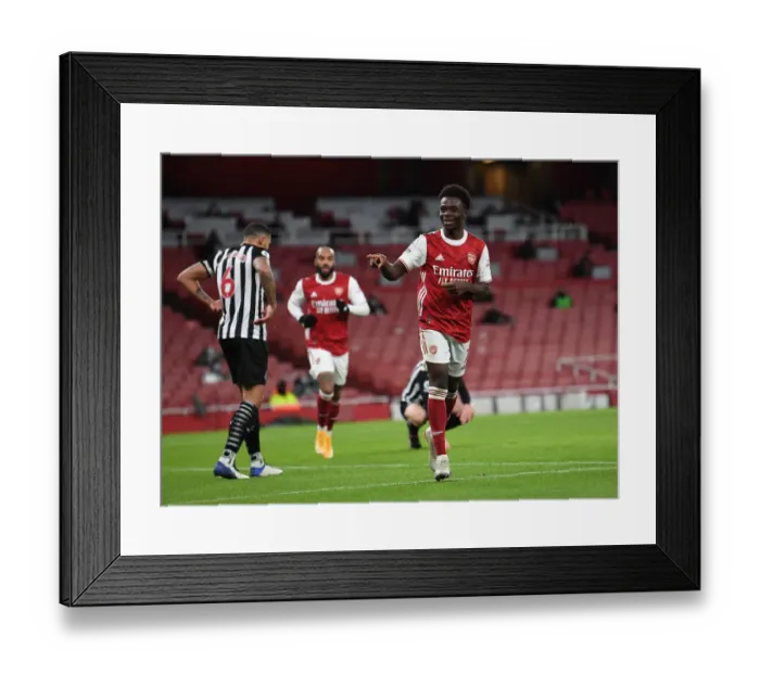 Framed Print : Arsenal's Bukayo Saka Scores Second Goal Against Newcastle United in Empty Emirates Stadium, Premier League 2020-21