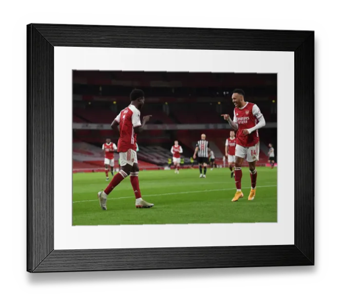 Framed Print : Arsenal's Saka and Aubameyang Celebrate Goals in Empty Emirates Stadium Against Newcastle United (2021) Framed Print : Arsenal's Saka and Aubameyang Celebrate Goals in Empty Emirates Stadium Against Newcastle United (2021)