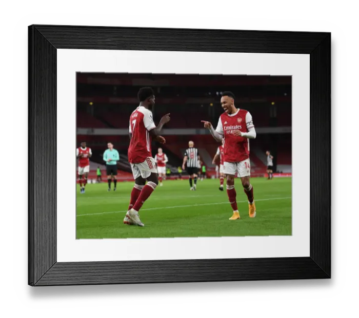 Framed Print : Arsenal's Bukayo Saka and Pierre-Emerick Aubameyang Celebrate Goals Amidst Empty Emirates Stadium (Arsenal v Newcastle United, Premier League 2021)