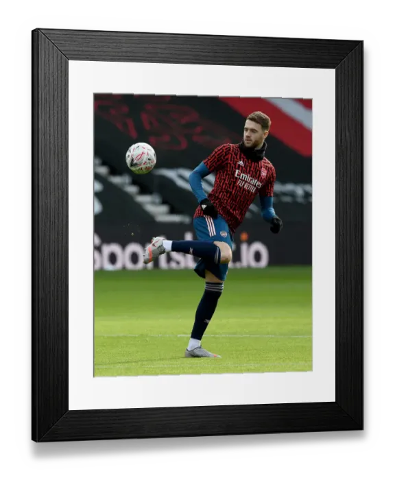 Framed Print : Arsenal's Calum Chambers Prepares for FA Cup Clash Against Southampton Amidst Empty Stands