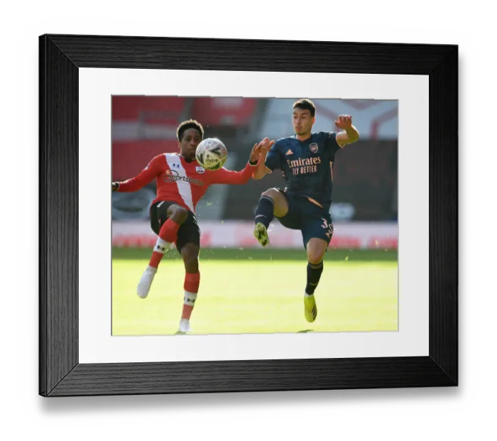 Framed Print : FA Cup Fourth Round: Southampton vs. Arsenal - Gabriel Martinelli's Battle with Walker-Peters Amid Empty Stands Framed Print : FA Cup Fourth Round: Southampton vs. Arsenal - Gabriel Martinelli's Battle with Walker-Peters Amid Empty Stands