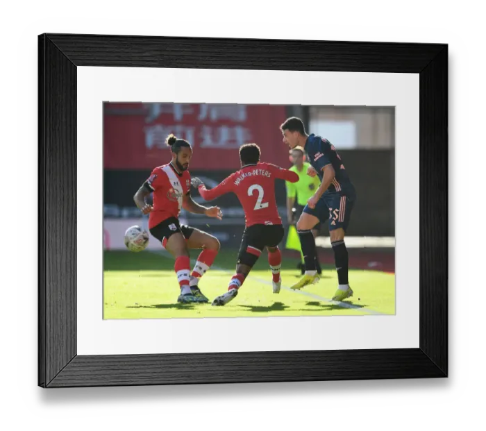 Framed Print : Arsenal's Martinelli Navigates Past Southampton: FA Cup 4th Round Clash Amidst Empty Stands
