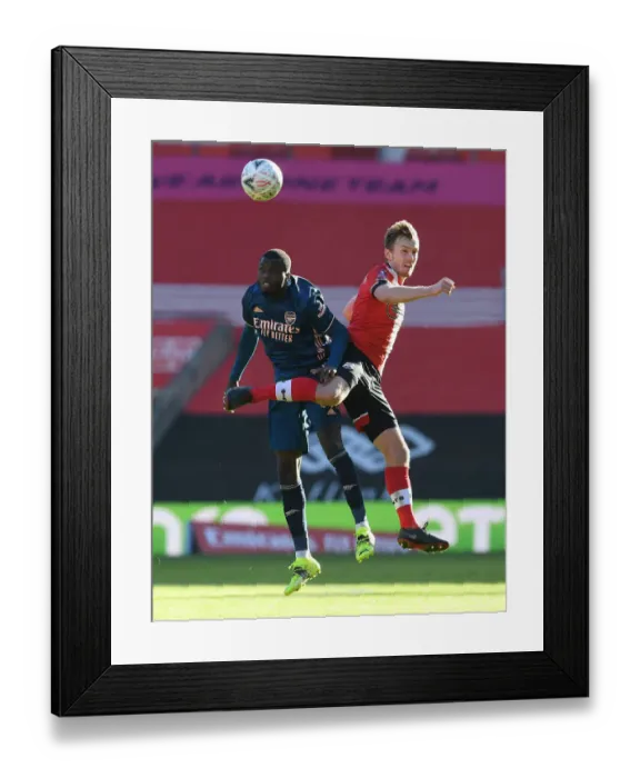 Framed Print : Pepe vs Ward-Prowse: FA Cup Clash Between Southampton and Arsenal Amidst Empty Stands Framed Print : Pepe vs Ward-Prowse: FA Cup Clash Between Southampton and Arsenal Amidst Empty Stands