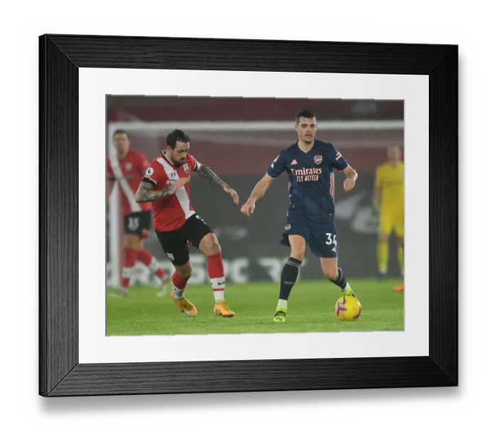 Framed Print : Xhaka vs Ings: A Battle in Empty St Mary's - Southampton vs Arsenal, Premier League 2021