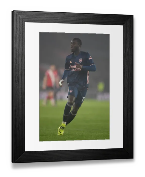 Framed Print : Arsenal's Nicolas Pepe Plays in Empty Southampton Stadium - Premier League 2020-21