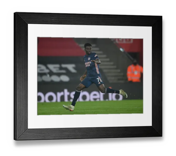 Framed Print : Bukayo Saka's Brilliant Performance at Empty Southampton Stadium - Arsenal's Premier League Victory 2020-21