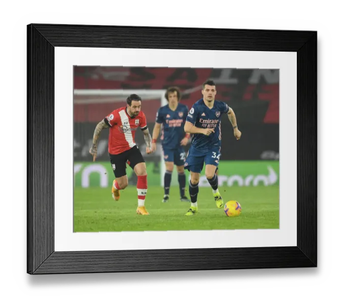 Framed Print : Granit Xhaka Breaks Past Danny Ings: Southampton vs Arsenal, Premier League 2021 (Behind Closed Doors) Framed Print : Granit Xhaka Breaks Past Danny Ings: Southampton vs Arsenal, Premier League 2021 (Behind Closed Doors)