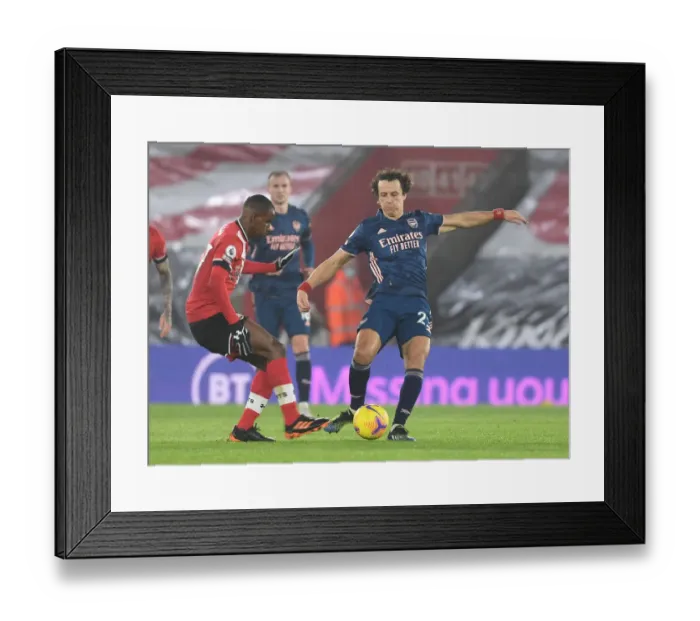 Framed Print : David Luiz vs Ibrahima Diallo: A Battle in Empty St. Mary's Stadium - Premier League 2021: Southampton vs Arsenal