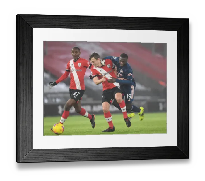 Framed Print : Pepe vs Ward-Prowse: Clash in Empty St. Mary's Stadium - Southampton vs Arsenal, Premier League 2020-21
