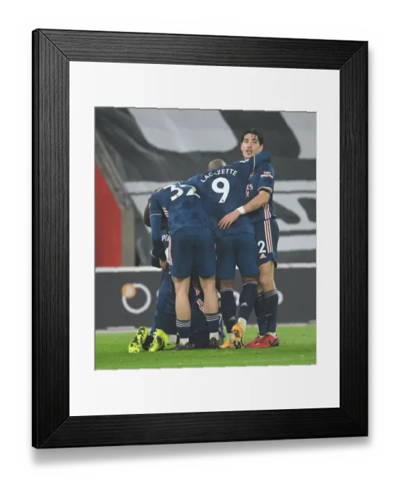 Framed Print : Arsenal's Bellerin, Lacazette, and Smith Rowe Celebrate 2nd Goal Against Southampton in Empty St. Mary's Stadium (2020-21)