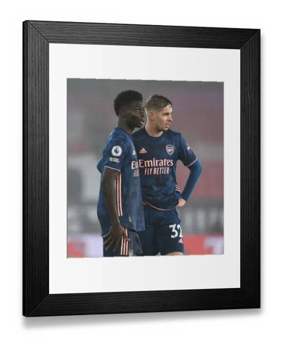 Framed Print : Arsenal's Saka and Smith Rowe in Action at Empty Southampton Stadium (Southampton v Arsenal, 2021-22 Premier League)