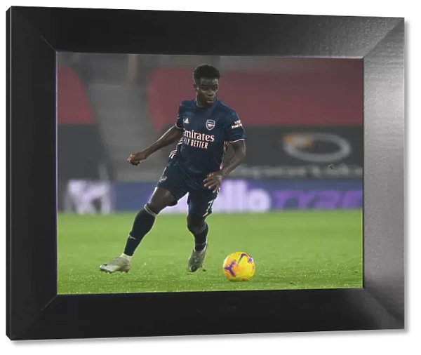 Arsenal's Bukayo Saka in Action against Southampton in Empty St. Mary's Stadium (Premier League 2020-21)