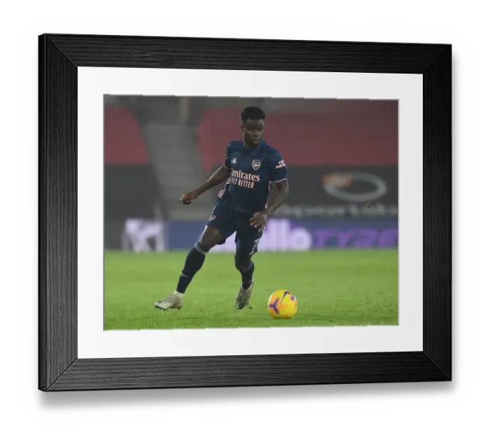 Framed Print : Arsenal's Bukayo Saka in Action against Southampton in Empty St. Mary's Stadium (Premier League 2020-21) Framed Print : Arsenal's Bukayo Saka in Action against Southampton in Empty St. Mary's Stadium (Premier League 2020-21)
