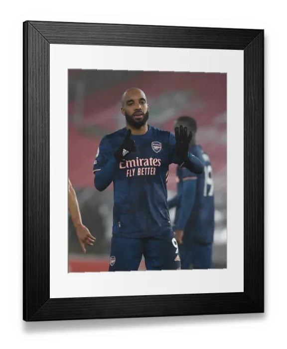Framed Print : Alexis Lacazette's Hat-Trick: Arsenal's Empty-Stadium Victory Over Southampton (2021)