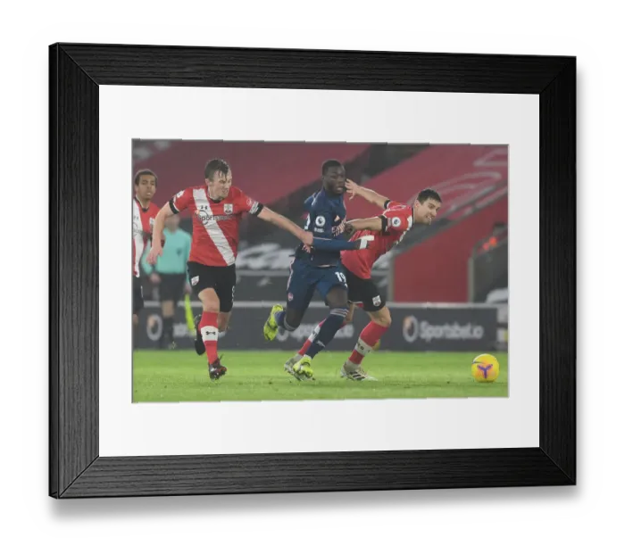 Framed Print : Pepe Breaks Past Southampton Defenders in Empty St. Mary's Stadium - Southampton vs Arsenal, Premier League 2020-21