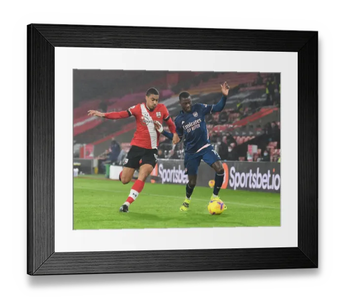 Framed Print : Pepe Holds Off Valery: Southampton vs. Arsenal, Premier League 2021 (Behind Closed Doors)