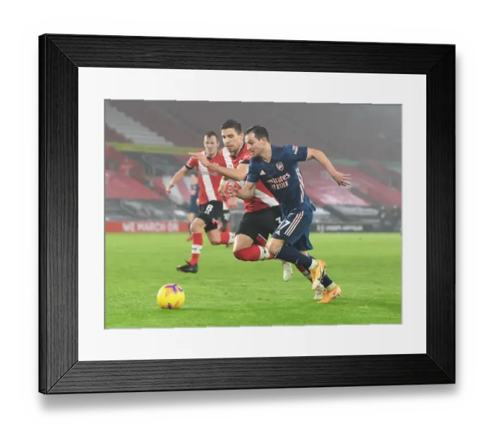 Framed Print : Arsenal's Cedric Breaks Past Southampton's Bednarek in Empty St. Mary's Stadium - Southampton vs Arsenal, Premier League 2021