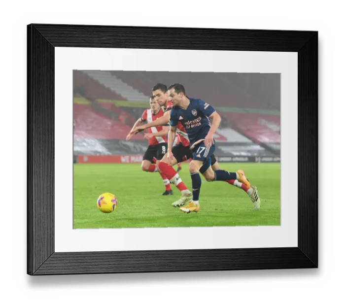 Framed Print : Arsenal's Cedric Outmaneuvers Southampton's Bednarek in Empty St. Mary's Stadium - Premier League 2021 (Southampton vs Arsenal)