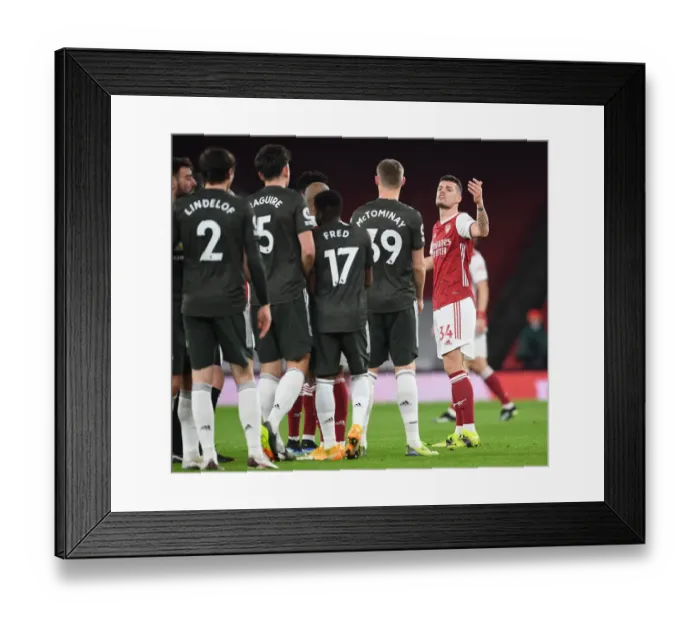 Framed Print : Arsenal vs Manchester United: Xhaka's Heated Clash Amid Empty Emirates Stadium (Premier League 2020-21) Framed Print : Arsenal vs Manchester United: Xhaka's Heated Clash Amid Empty Emirates Stadium (Premier League 2020-21)
