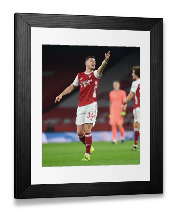 Framed Print : Arsenal's Granit Xhaka Shines in Empty Emirates Stadium: Arsenal vs Manchester United (Premier League 2021) Framed Print : Arsenal's Granit Xhaka Shines in Empty Emirates Stadium: Arsenal vs Manchester United (Premier League 2021)
