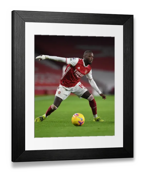 Framed Print : Arsenal vs Manchester United: Pepe in Action at Empty Emirates Stadium (2020-21)