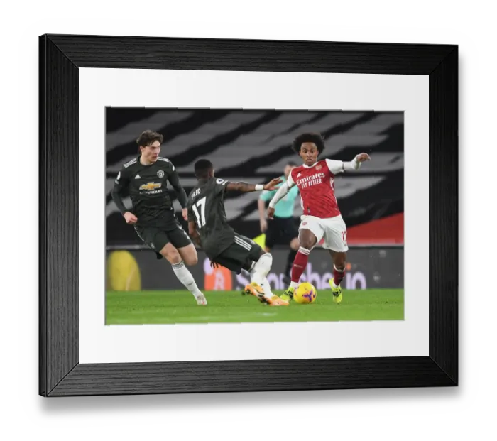 Framed Print : Arsenal vs Manchester United: Tension on the Pitch Amidst Empty Stands (2020-21)