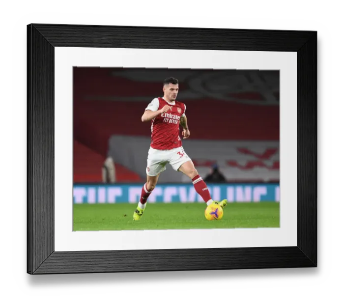 Framed Print : Arsenal's Xhaka Shines in Empty Emirates Victory Over Manchester United (Premier League 2021)