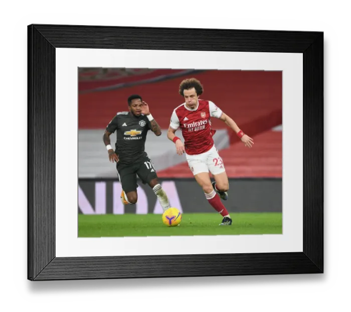 Framed Print : Arsenal's David Luiz Slips Past Manchester United's Fred: Empty Emirates Showdown, Premier League 2021 Framed Print : Arsenal's David Luiz Slips Past Manchester United's Fred: Empty Emirates Showdown, Premier League 2021