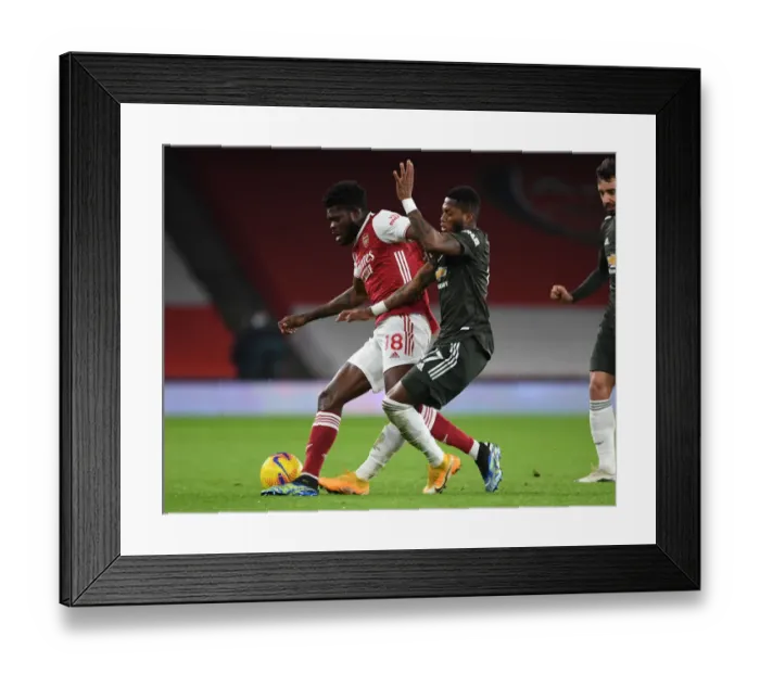 Framed Print : Thomas Partey Stands Firm: Arsenal vs Manchester United Showdown at Empty Emirates, Premier League 2021 Framed Print : Thomas Partey Stands Firm: Arsenal vs Manchester United Showdown at Empty Emirates, Premier League 2021