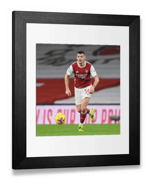 Framed Print : Arsenal's Xhaka Stands Out in Empty Emirates Victory Over Manchester United (Premier League 2021)