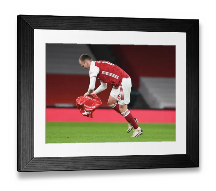 Framed Print : Arsenal vs Manchester United: Rob Holding Clears Object from Empty Emirates Stadium during Premier League Match Amid Coronavirus Restrictions (2020-21) Framed Print : Arsenal vs Manchester United: Rob Holding Clears Object from Empty Emirates Stadium during Premier League Match Amid Coronavirus Restrictions (2020-21)