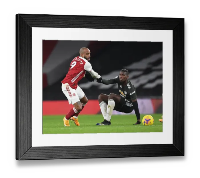 Framed Print : Arsenal vs Manchester United: Lacazette Consoles Pogba Amid Empty Emirates Stadium (2020-21)