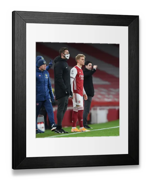 Framed Print : Arsenal Debut: Martin Odegaard Makes First Appearance Against Manchester United in Empty Emirates Stadium (Arsenal v Manchester United 2021)