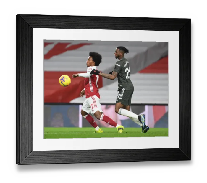 Framed Print : Arsenal vs Manchester United: Empty-Stadium Showdown - Willian vs Wan-Bissaka Amidst Pandemic Restrictions Framed Print : Arsenal vs Manchester United: Empty-Stadium Showdown - Willian vs Wan-Bissaka Amidst Pandemic Restrictions