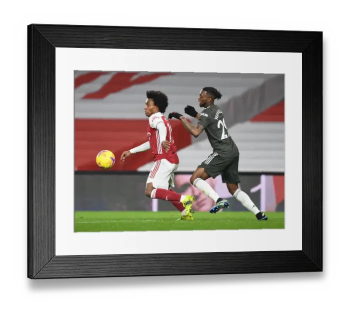 Framed Print : Arsenal vs Manchester United: Willian vs Wan-Bissaka in Empty Emirates Stadium (Premier League 2020-21)