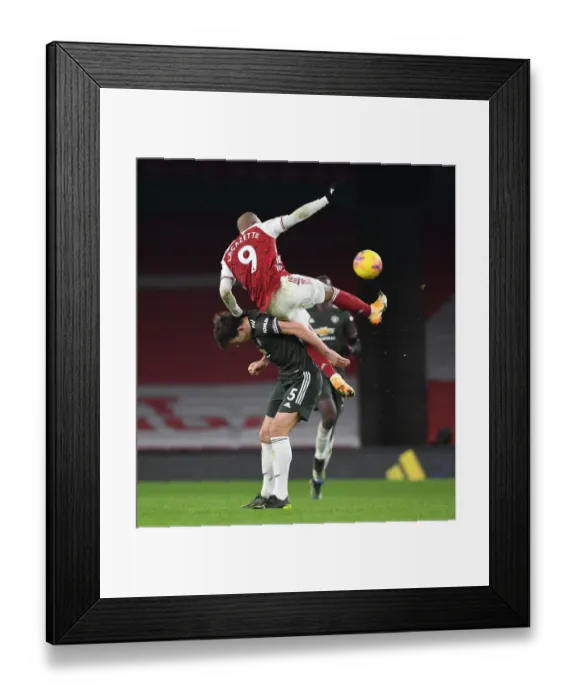 Framed Print : Arsenal vs Manchester United: Lacazette vs Maguire - Premier League Clash in Empty Emirates Stadium (January 2021) Framed Print : Arsenal vs Manchester United: Lacazette vs Maguire - Premier League Clash in Empty Emirates Stadium (January 2021)
