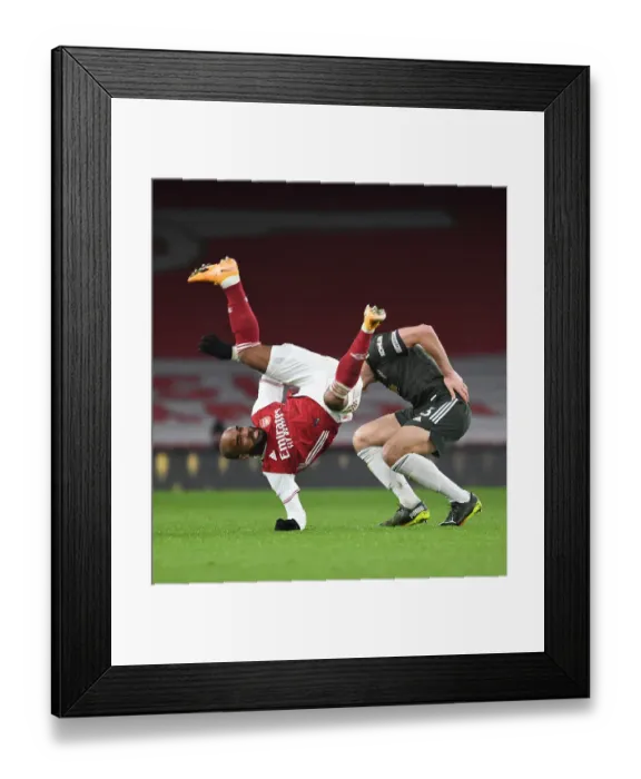 Framed Print : Arsenal vs Manchester United: Lacazette vs Maguire - Premier League Rivalry Under Coronavirus Restrictions (January 2021)