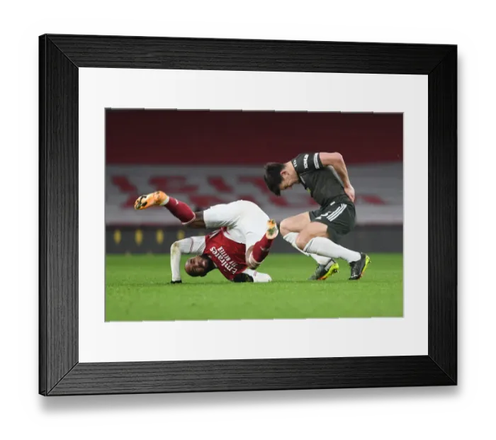 Framed Print : Arsenal vs Manchester United: Lacazette vs Maguire - Empty Seat Showdown (Premier League 2021)