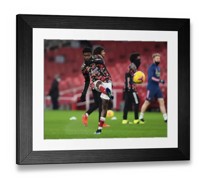 Framed Print : Thomas Partey Prepares for Empty Emirates Clash: Arsenal vs Manchester United (2020-21) Framed Print : Thomas Partey Prepares for Empty Emirates Clash: Arsenal vs Manchester United (2020-21)